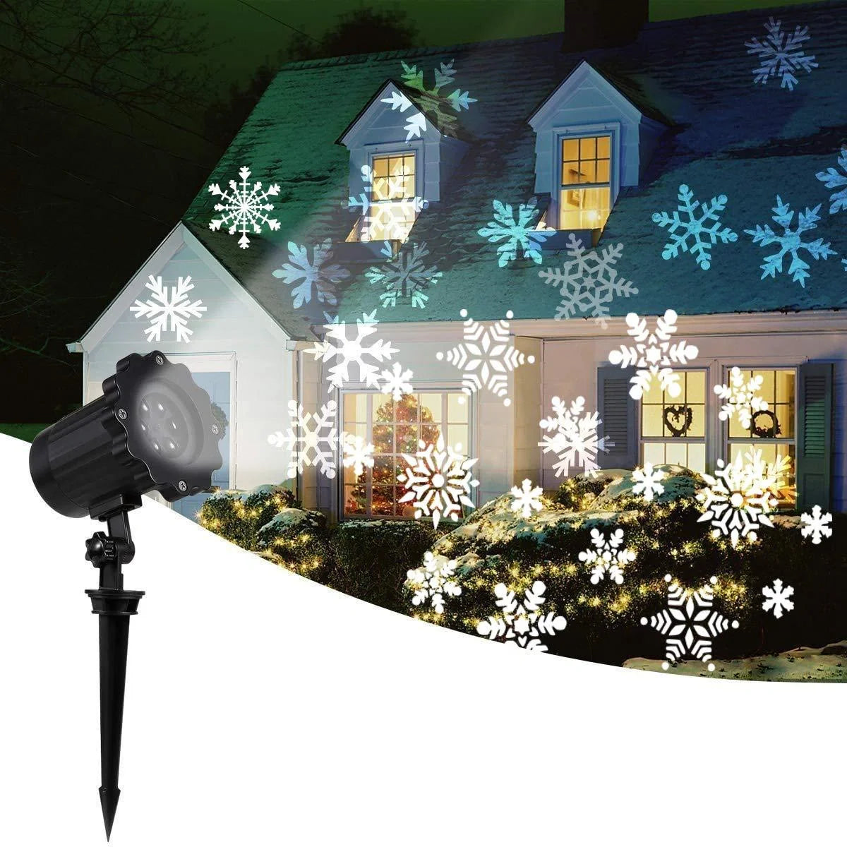 LED Christmas Snowflake Laser Projector casting white snowflakes on a wall