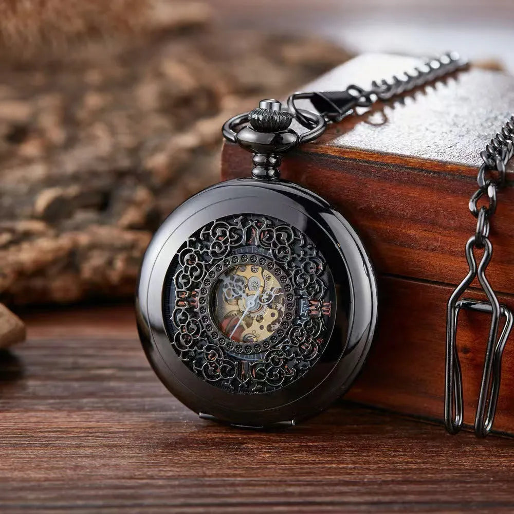Retro automatic pocket watch with floral print dial and transparent case back showing mechanical movement.