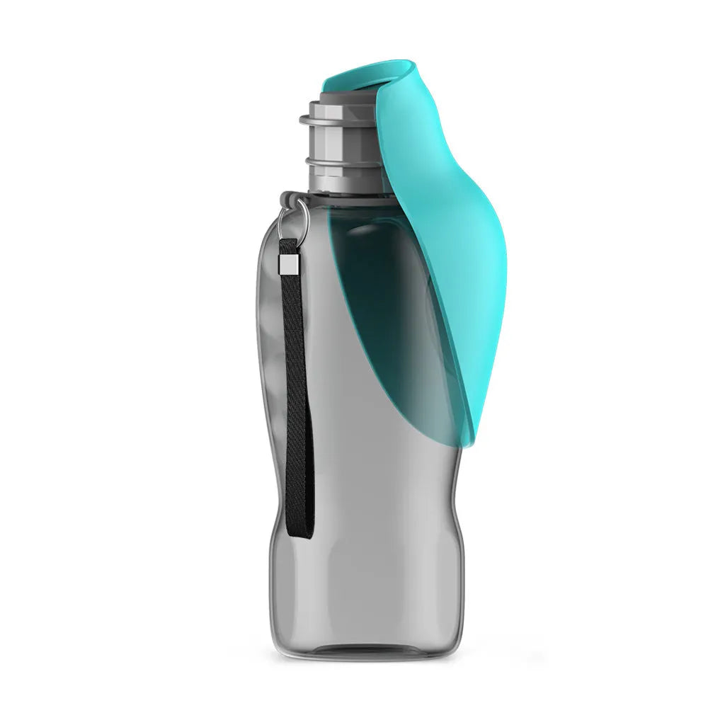 Blue grey portable dog water bottle with foldable drinking bowl and wrist strap, shown next to a dog.
