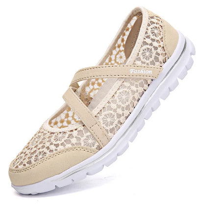 Women's beige mesh lace-up flat shoes with round toe and sewing line detail on a white background.