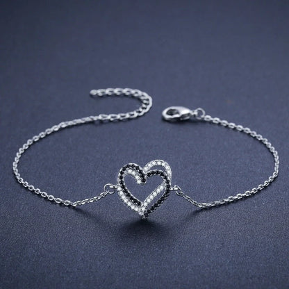 Black titanium steel heart bracelet for women, elegant and durable jewelry piece