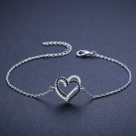 Black titanium steel heart bracelet for women, elegant and durable jewelry piece