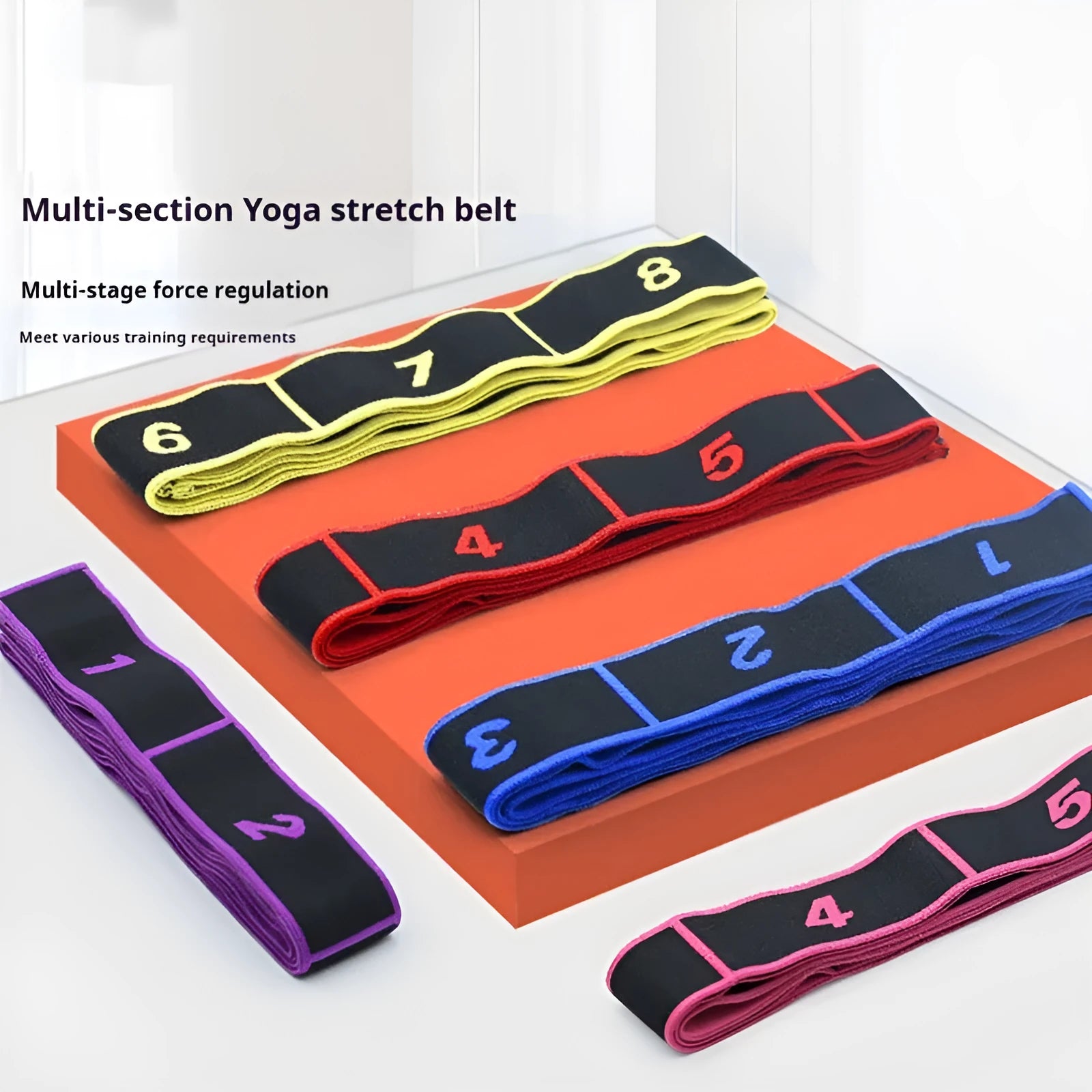 Blue multi-section yoga stretch strap for Pilates and dance exercises on a wooden floor
