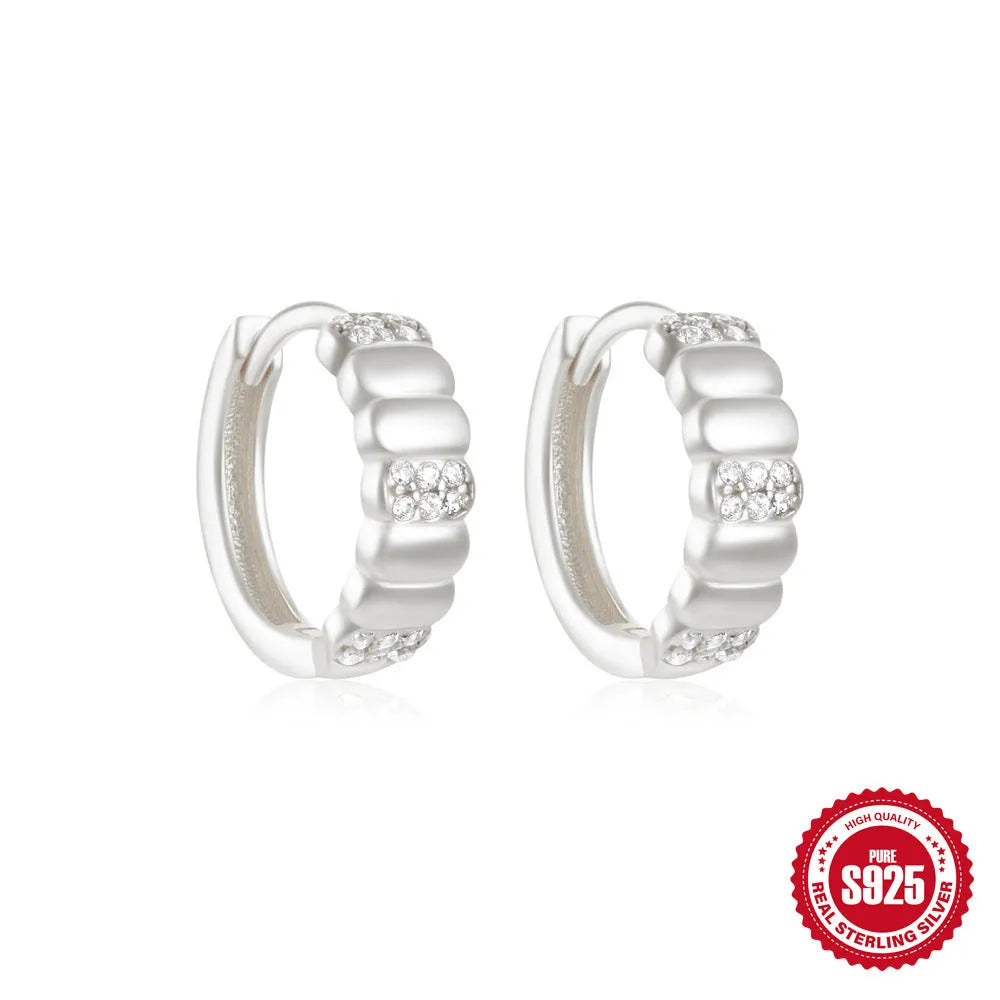 Sterling silver geometric stud earrings with small round diamond accents in gold or silver finish