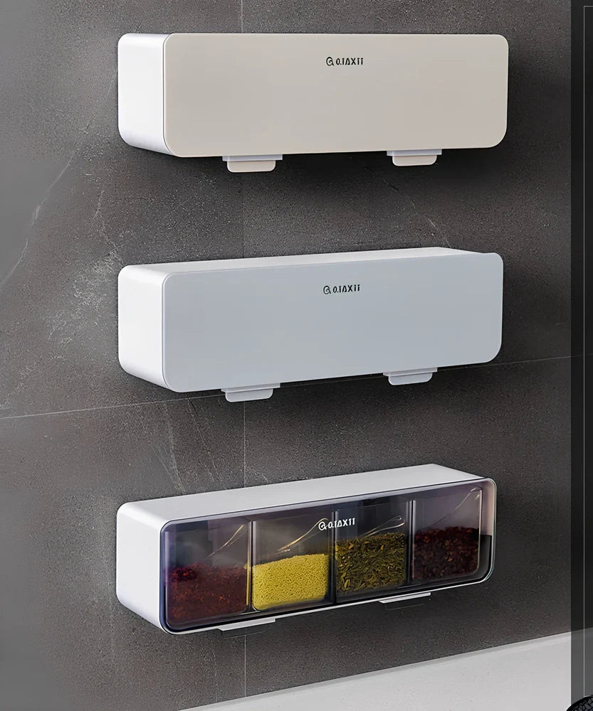 Wall-mounted plastic spice box set with multiple compartments and measuring spoon in kitchen