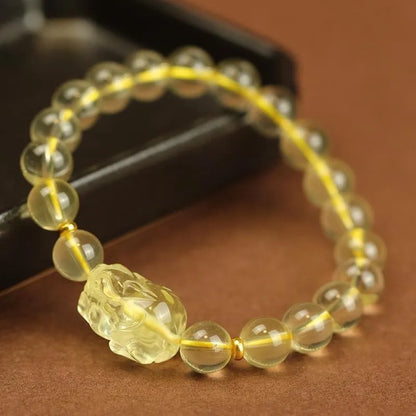 Yellow leather bracelet with citrine Pi Xiu charm and beads in selectable sizes.