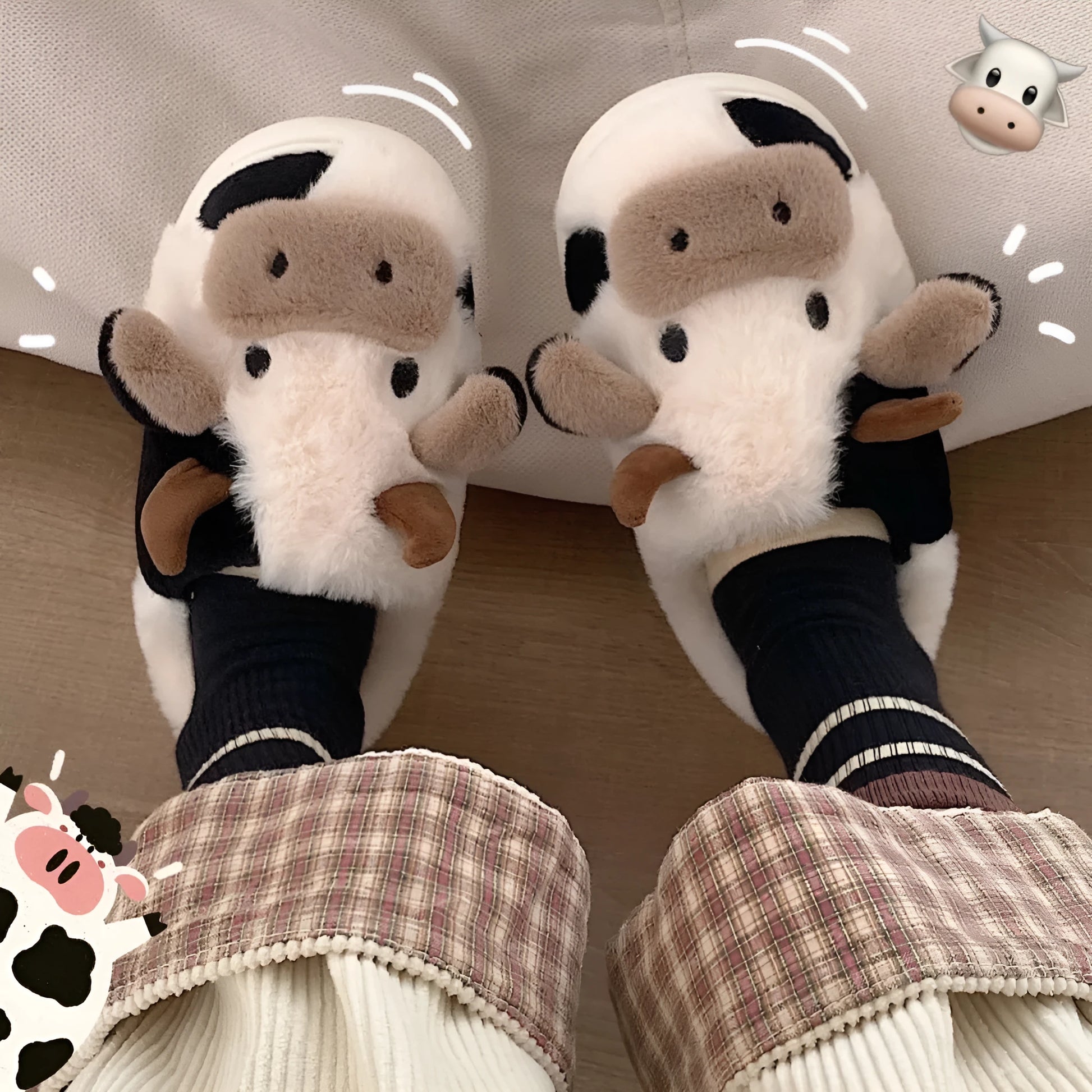 White cow-themed plush slippers with a non-slip textured sole for women.