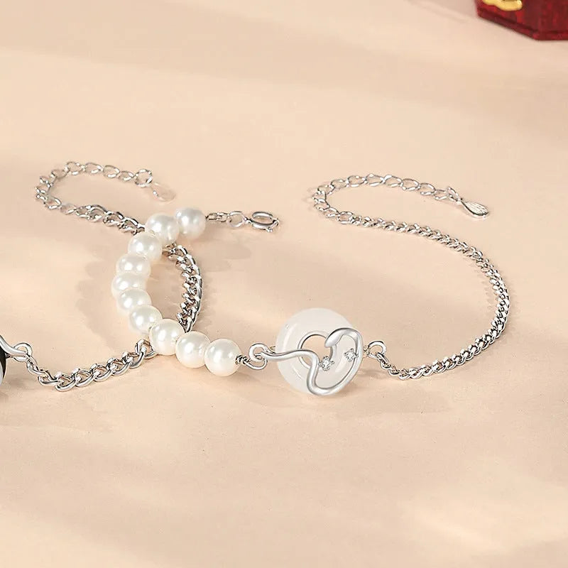 925 sterling silver couple's bracelet with obsidian pearl and snake detail in New Chinese style.