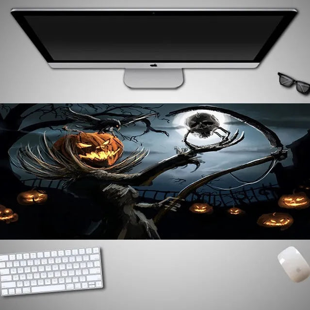 Halloween-themed oversized cloth mouse pad with non-slip rubber base on a wooden desk.
