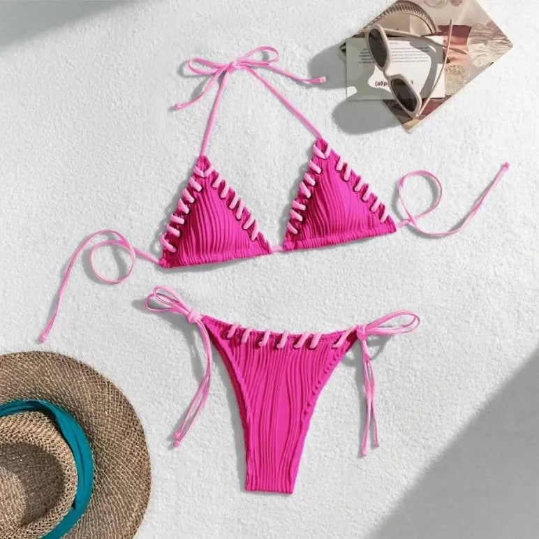 Women's solid colour polyester bikini with eye rope detail, briefs style, sizes S M L