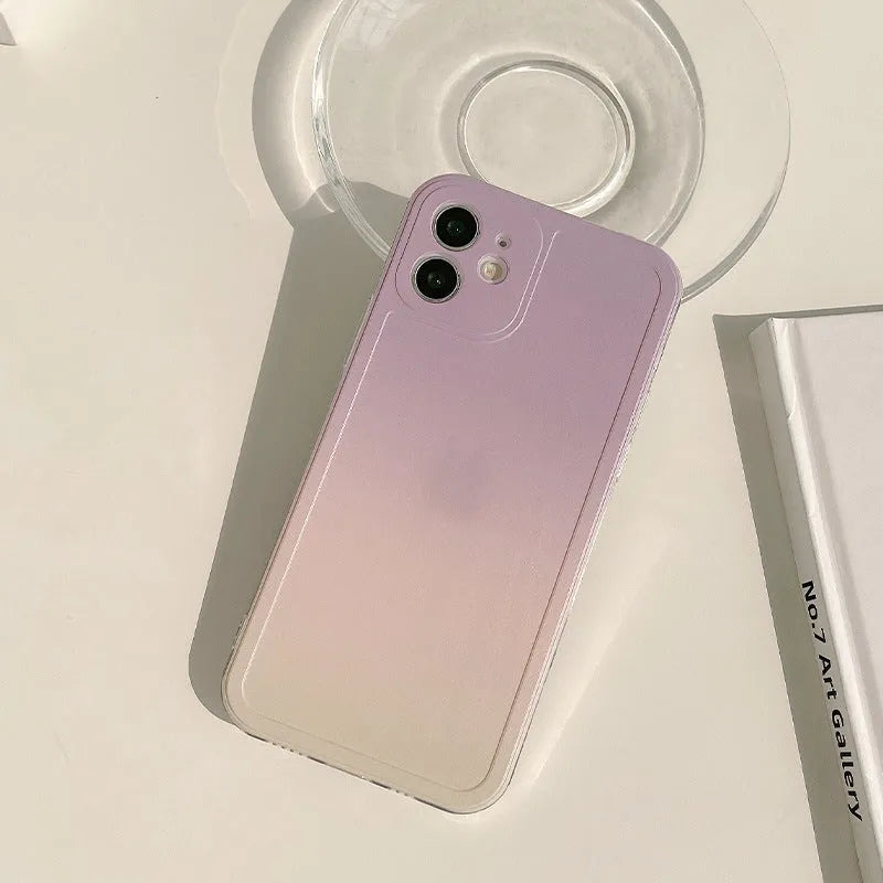 Yellow to purple gradient silicone iPhone case with a pop-out kickstand deployed.