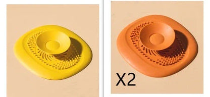 TPR vortex design sink drain cover in twilight orange, quiet blue, mango yellow, and gentian green