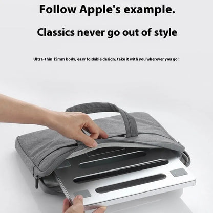 Silver aluminium alloy folding laptop cooling rack on a wooden desk