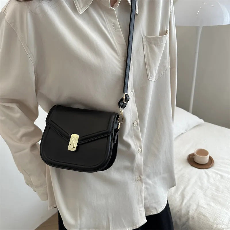 Soft PU leather messenger bag with clamshell opening in black, dark brown, khaki or white.