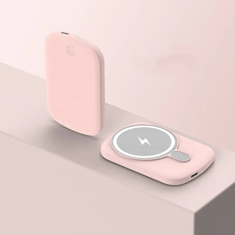 Magsafe magnetic wireless power bank in black, attached to an iPhone.