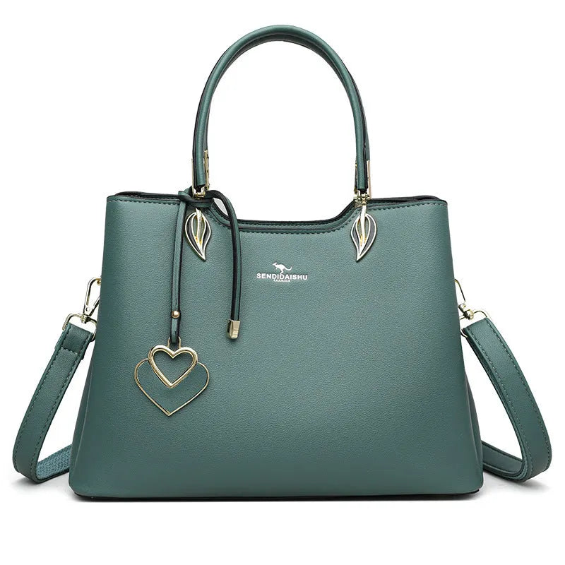 Women's black PU leather messenger bag with multi-layer shoulder strap and sewing thread detailing.
