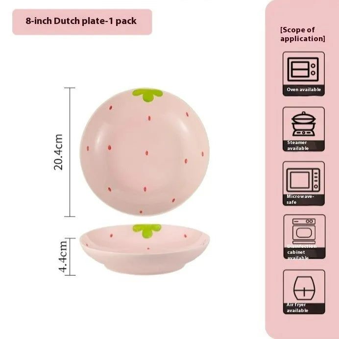 Porcelain dinnerware set with strawberry pattern, showing plates, bowls, and a twist spoon in various sizes