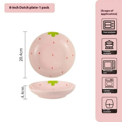 Porcelain dinnerware set with strawberry pattern, showing plates, bowls, and a twist spoon in various sizes
