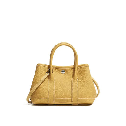 Genuine leather crossbody bag for women in first layer cowhide, horizontal square shape, single shoulder strap, shown in chicken yellow