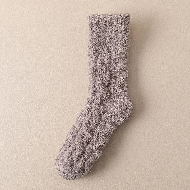Cozy coral fleece socks in various colors, designed for superior comfort and warmth