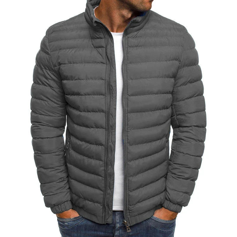 Warm padded winter jacket for men in various solid colors, featuring zippered pockets and a loose, comfortable fit for easy layering.