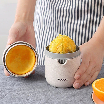 Versatile manual citrus juicer for extracting nutritious juices from oranges, lemons, grapefruits, and more using a compact and durable design