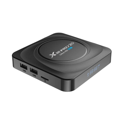 Android dual-band WiFi Bluetooth TV set-top box with remote control on a table