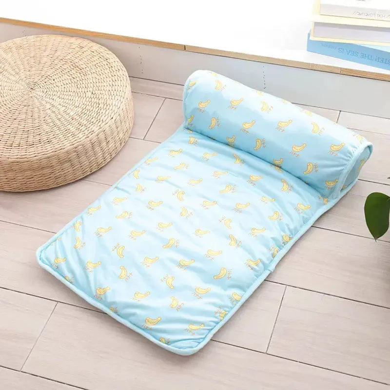 Pink blue green dog cooling mat on floor with pet, showing medium and large size options