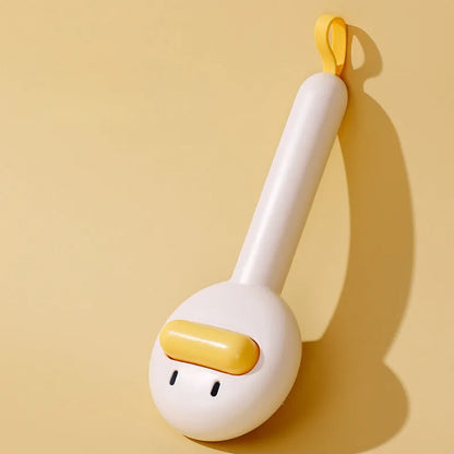 Small yellow duck-shaped pet grooming comb with needle pins and open section design