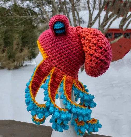 Handmade crochet octopus hat in vibrant colors, perfect for Halloween or casual wear