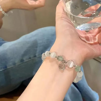 Handmade glass butterfly bracelet with drop-shaped beads in moonlight grey colour variation