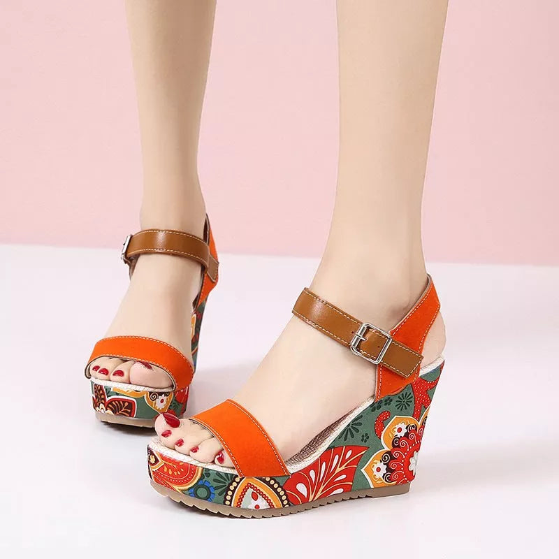 Women's floral embroidered high wedge sandals with buckle strap in black, green, and orange