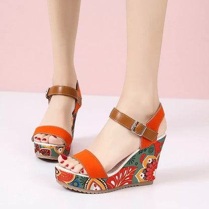 Women's floral embroidered high wedge sandals with buckle strap in black, green, and orange