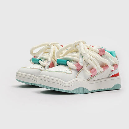 A pair of thick-soled casual lace-up shoes in a solid colour with a round toe and mesh lining.