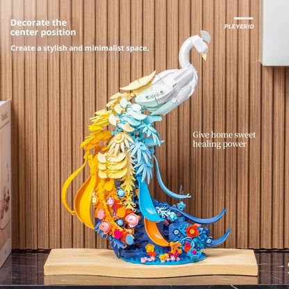 Colourful plastic building blocks assembled as peacock and swan designs with flower-like brocade patterns