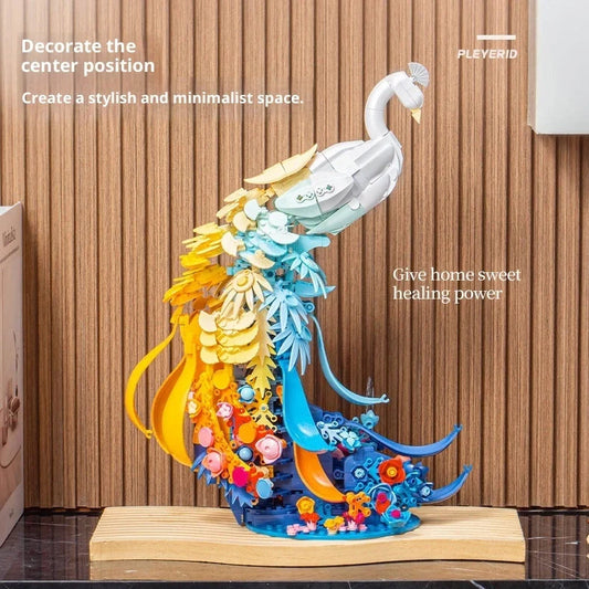 Colourful plastic building blocks assembled as peacock and swan designs with flower-like brocade patterns