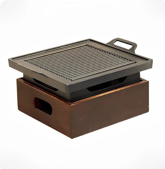 Korean baking pan set with four different sized pans in wooden storage block