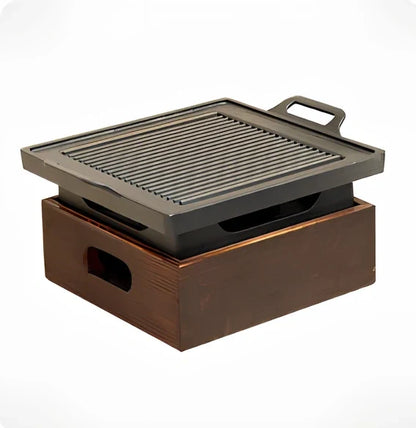 Korean baking pan set with four different sized pans in wooden storage block