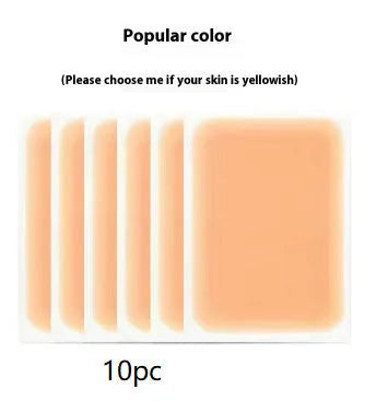 Tattoo cover patch and a 130mm long concealer brush on a table, with colour option swatches visible.