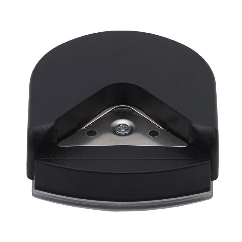 Black plastic and metal business card corner cutter on a white background