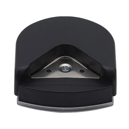 Black plastic and metal business card corner cutter on a white background