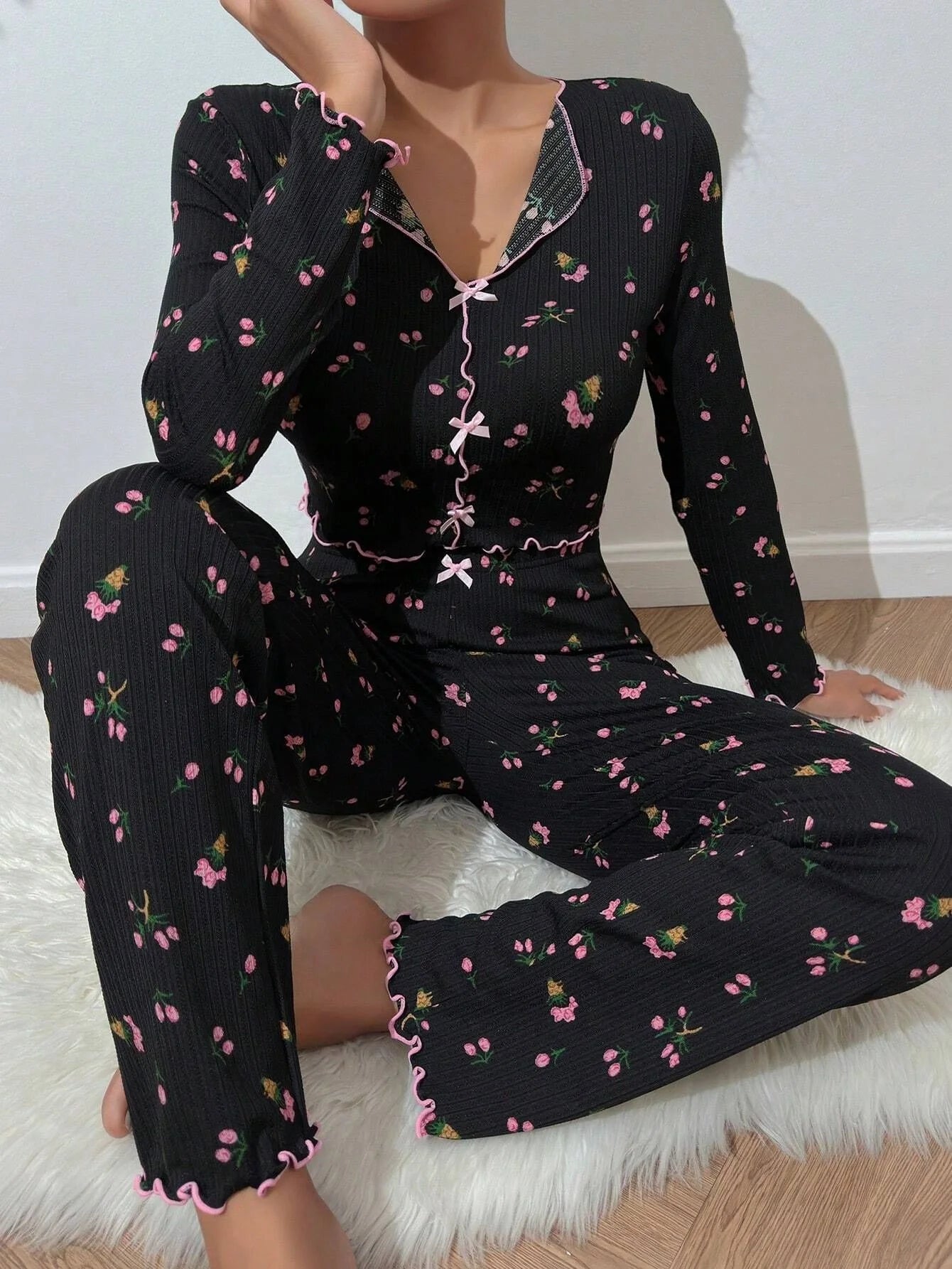 Stylish two-piece loungewear set in vibrant floral prints, featuring a long sleeve top and coordinating pants for all-season comfort and versatility.