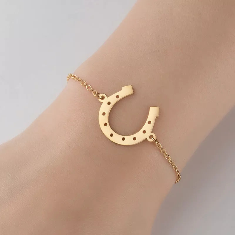 Punk Horse Shoe Chain Bracelet in gold and steel colors, featuring a unique U-shape charm