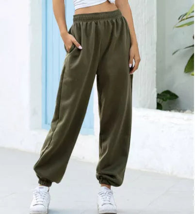 Plus-size slacks in black, grey, and green with elastic waistband