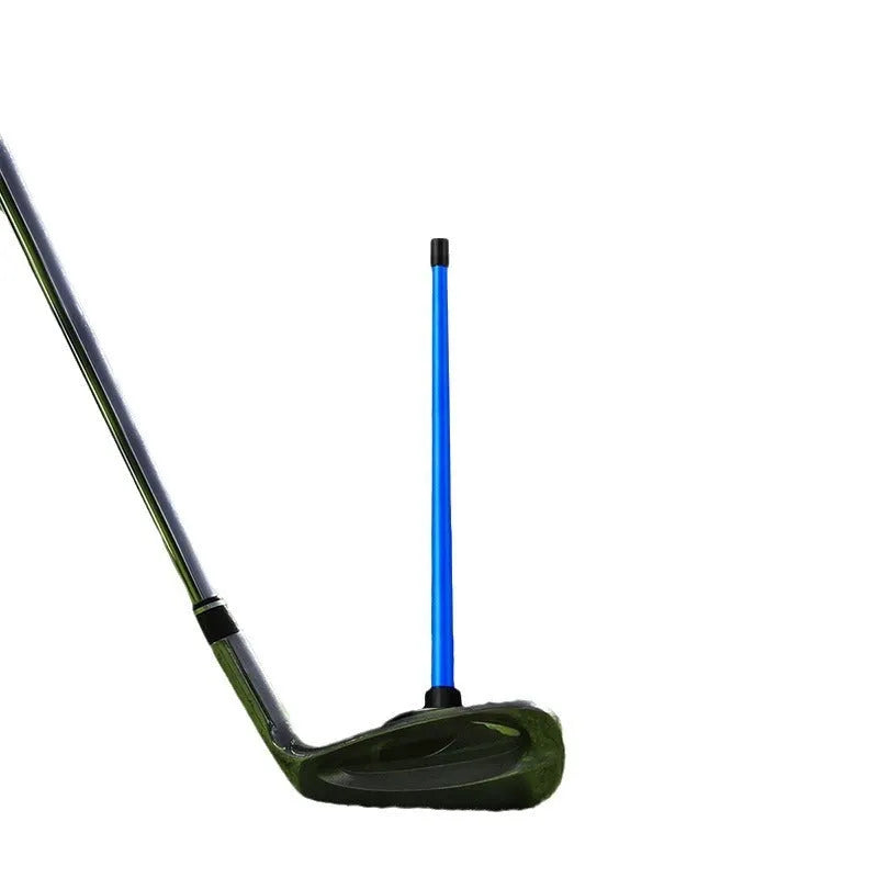 Red anodised aluminium golf swing trainer with magnetic indicator clipped onto a club shaft