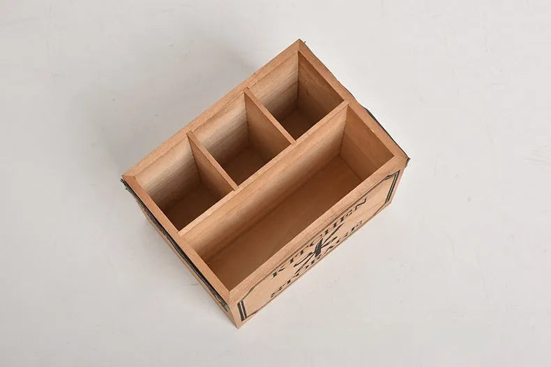 Solid wood kitchen storage box with internal grid divider for organising cutlery and chopsticks.