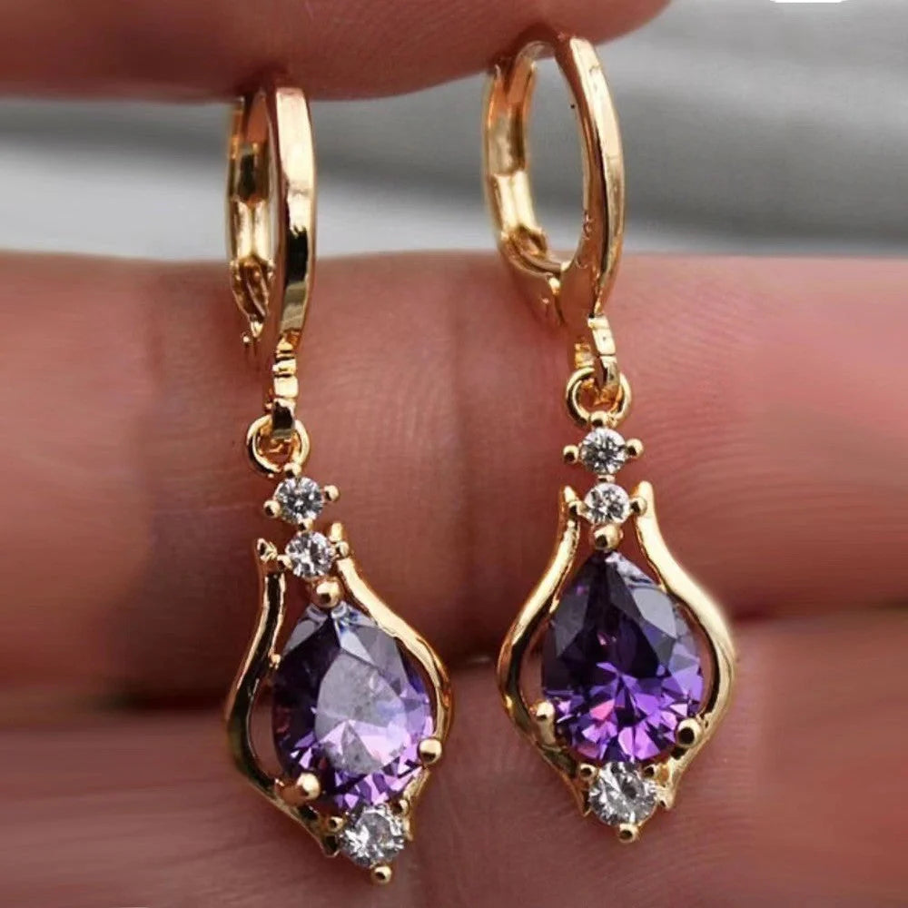 Elegant drop-shaped earrings with shimmering zircon accents in various colors, including purple, white, red, pink, and champagne