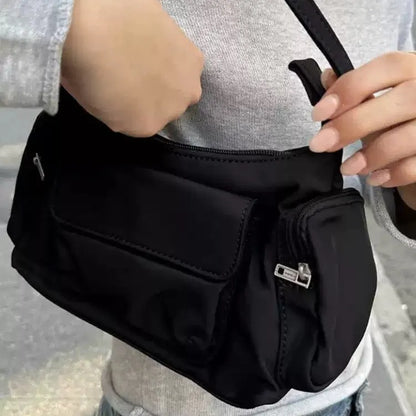 Black PU women's shoulder bag with two pockets and side line detailing, showing dimensions of 24cm length