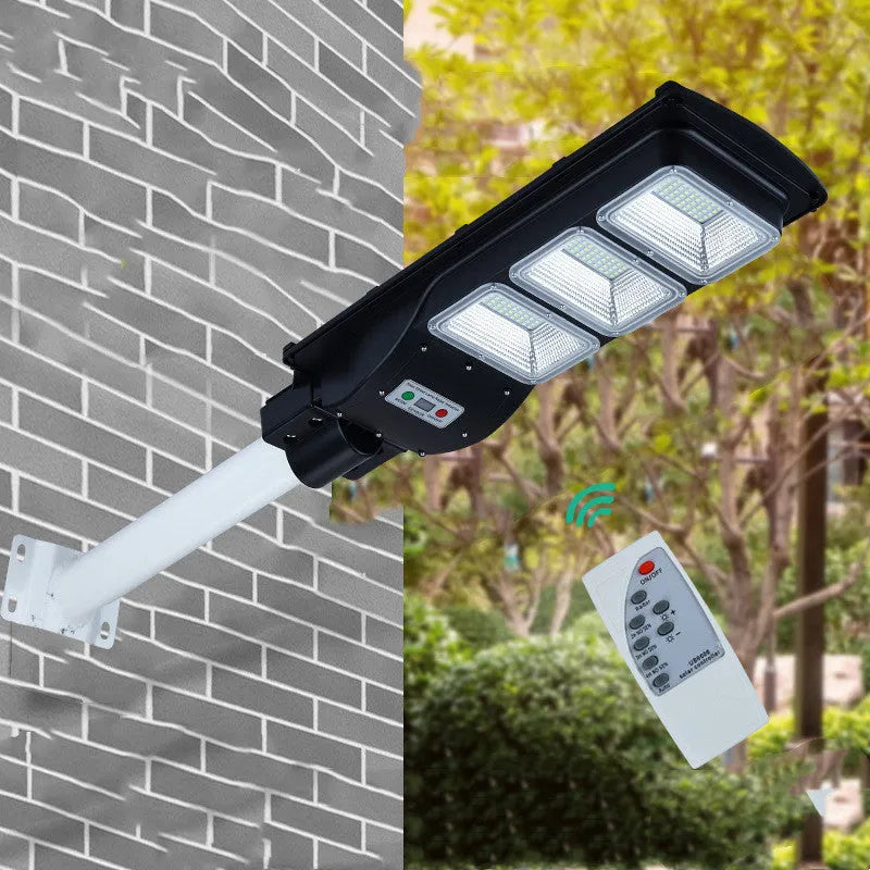 Integrated solar street light with LED illumination and solar panel, remote control operation