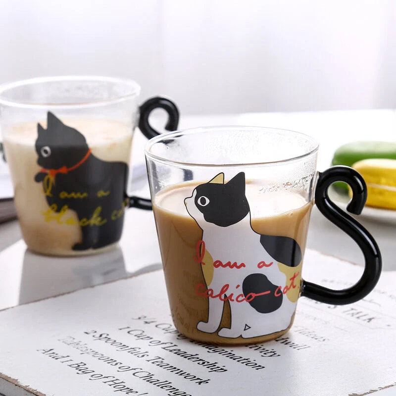 Adorable cat-shaped glass mug in black and white colors, perfect for coffee, tea, or juice